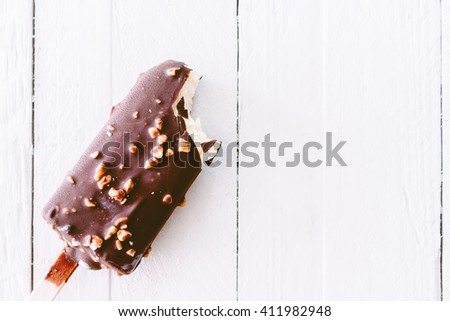 Bite Ice cream chocolate on wooden background
