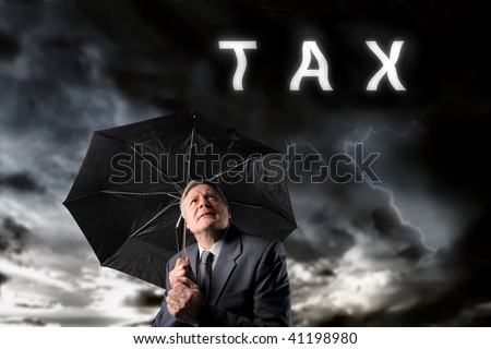 mature businessman under a storm of taxes