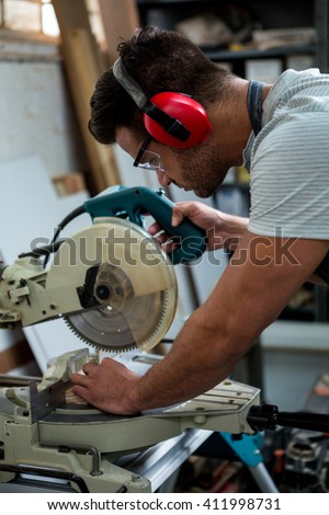 Carpenter working on his craft in his workshop