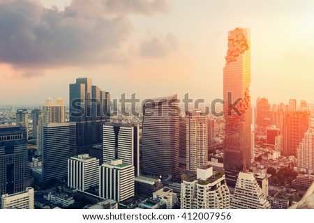 Skyline of big city full of skyscrapers in the business district of Bangkok at night. Royalty-Free Stock Photo #412007956