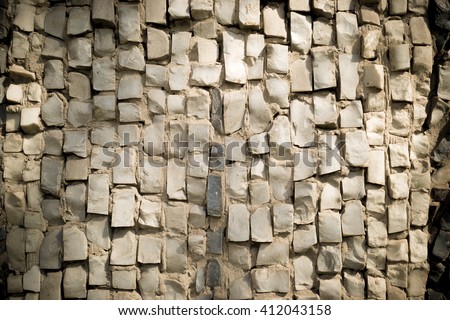 Wall decorated with  pattern of colorful mosaics.The photograph used on the edges of weak vignette, mosaic creates a beautiful pattern.It can be used as the background or texture for any photo editor.