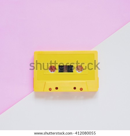 Retro cassette tape on pastel color background, minimal style 