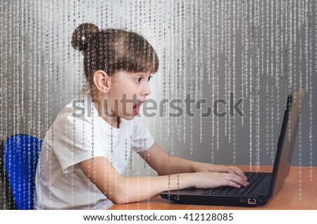 Hacker girl enjoys playing in a laptop