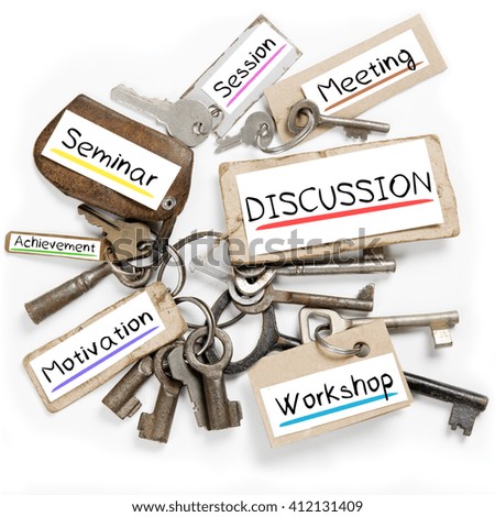 Photo of key bunch and paper tags with DISCUSSION conceptual words