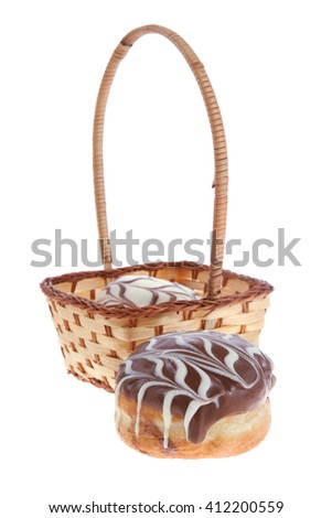 traditional jewish holiday chanuka donuts covered by dark and white chocolate pattern on retro vintage basket isolated on white background