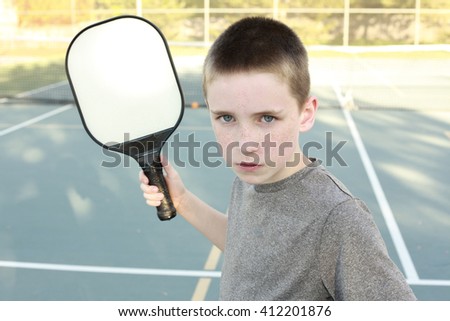 Boy playing Pickleball