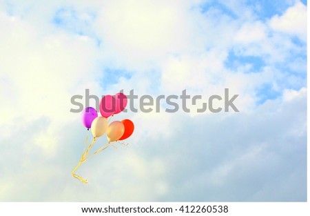 The colorful balloons with blue sky background, concept of love in summer and valentine, wedding. Selective focus on the balloons