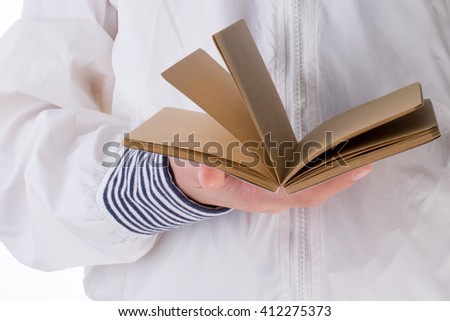 Hand holding a notebook on a white background