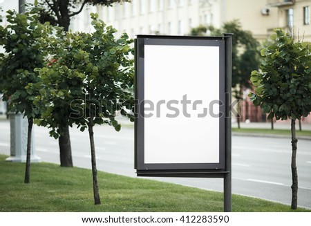 Blank street poster. Blank billboard on the city street. Isolated with clipping path. Shallow depth of field. Selective focus.