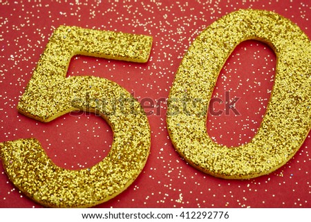 Number fifty golden color over a red background. Anniversary. Horizontal