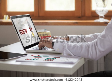 businessman working with laptop at the office. start up concept. All screen graphics are made up.