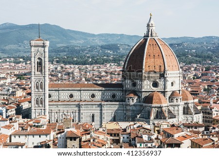 Cathedral Santa Maria del Fiore and Giotto's campanile in Florence, Tuscany, Italy. Cultural heritage. Historic centre. Urban scene. Cradle of the renaissance. Royalty-Free Stock Photo #412356937
