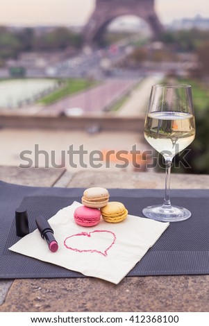 Wine glasses and Eiffel tower in Paris spring
