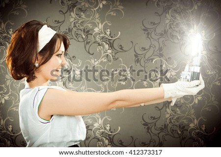 beautiful vintage girl take photograph with old camera on tapestry background