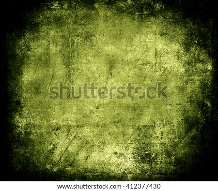 Beautiful green abstract vintage grunge background with faded central area for your text or picture, scratched scary background with frame