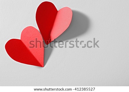 Red paper heart isolated on white background with copy space