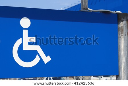 Parking for disabled persons sign. White on blue.      