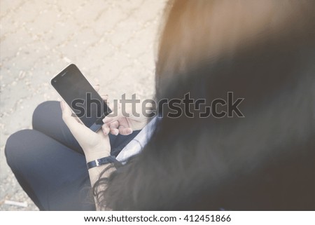 Business woman use of mobile phone