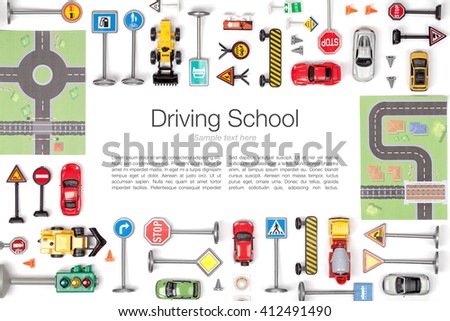 driving school concept. road signs and cars on white background. flat lay frame composition with copy space top view
