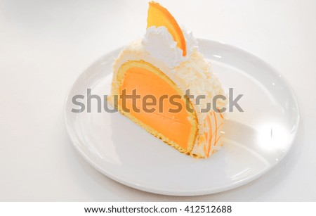 orange ice cream on white plate