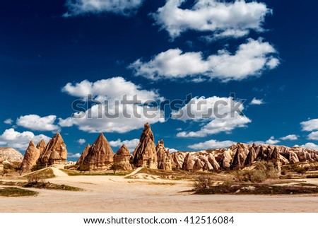 Panorama of unique geological formations in Cappadocia, Turkey. Cappadocian Region with its valley, canyon, hills located between the volcanic mountains Erciyes, Melendiz and Hasan.