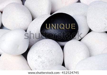 Unique text on stones, stand out of crowd concept.