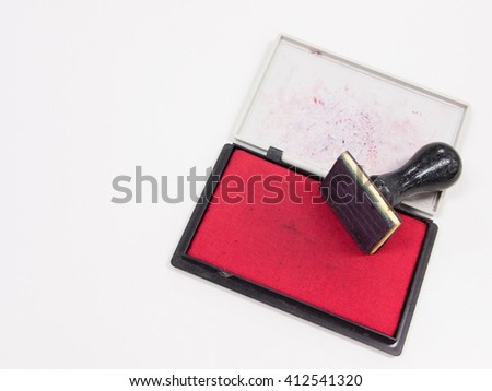 Signature rubber stamp with red ink on white background