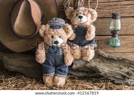 Two teddy bears take a photo in vintage barn studio