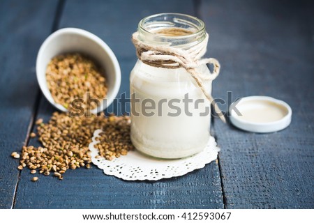vegan fresh milk from hemp seeds in a glass jar, clean eating,  non-dairy milk Royalty-Free Stock Photo #412593067