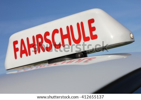 German driving school car roof sign