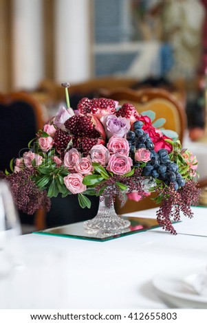 bouquet of roses, peonies, grapes and pomegranates in the Dutch style