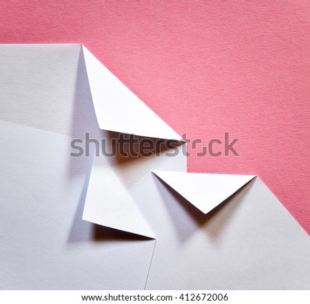 abstract white folded papers ticket on a pink background