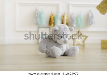 Teddy bear in colourful decoration closeup on the background