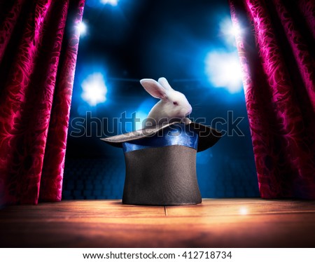 photo composite of a bunny in a magic hat on a stage