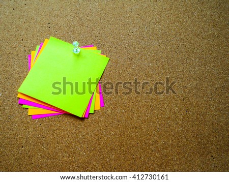 Colorful paper note on wood board with copy space