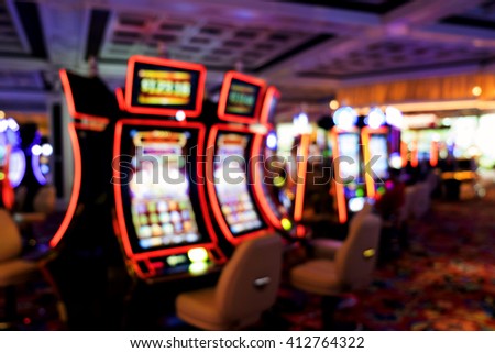 Blurry image with Bokeh from slot machine in casino Royalty-Free Stock Photo #412764322