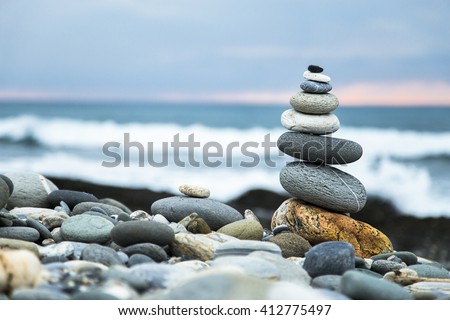 Zen stones on beach Royalty-Free Stock Photo #412775497