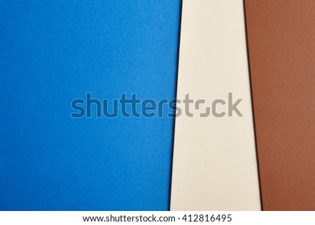 Colored cardboards background in blue beige brown tone. Copy space. Horizontal