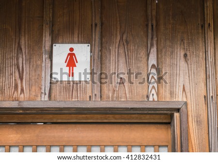 Woman toilet sign