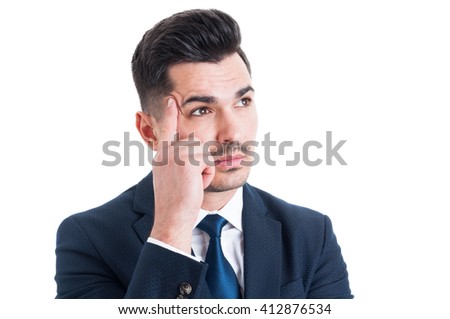Portrait of a handsome young businessman thinking isolated on white background