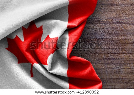 Flag of Canada on wood background
