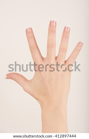 Friendly open hand isolated against white