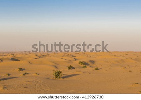 Sand dunes desert near by Dubai with a clear sky. United Arab Emirates