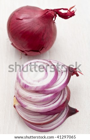 Chopped red onion on a white board