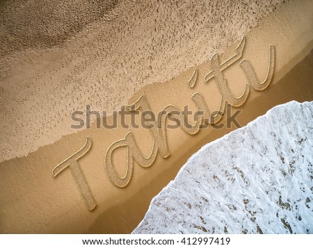 Tahiti written on the beach