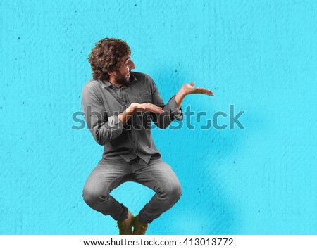 crazy young man jumping. happy expression