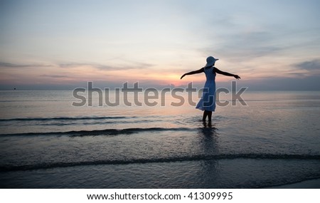 Happy woman on the beachfront. Travel collection.