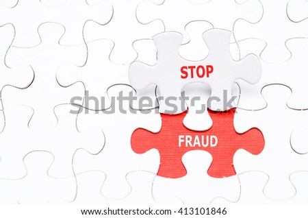 Stop Fraud concept on missing puzzle.