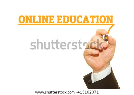 Businessman hand writing ONLINE EDUCATION on a transparent wipe board.