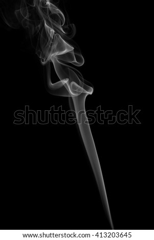 Abstract art. Grey smoke from the incense on a black background. Background for Halloween. Texture fog. Design element. The concept of aromatherapy.